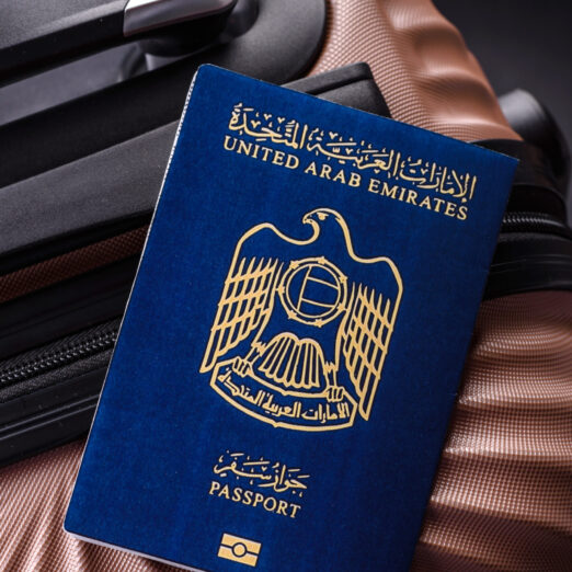 International passport of a citizen of United Arab Emirates on a suitcase, departure from the airport, international travel